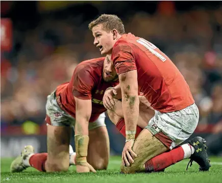  ?? PHOTO: GETTY IMAGES ?? It’s now 30 tests, and 64 years, since Wales last beat the All Blacks. Above, Hallam Amos and Owen Williams reflect on the latest defeat yesterday.