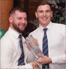  ??  ?? David Coyle (left) receives the Most Improved Player award from captain Neil Shortall.