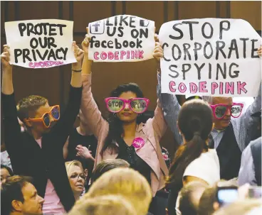  ?? OLIVIER douliery / ABACA FILES ?? Code Pink activists protest Facebook CEO Mark Zuckerberg prior to his testifying before the Senate judiciary and commerce committees in 2018 in Washington, D.C.