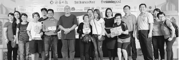  ??  ?? United Fusion Sdn Bhd director Linda Hoo (seventh from right, in white shirt), Mitraf 15 organisers and winners take one for the album.