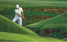  ?? AP ?? Sergio Garcia hits over Rae’s Creek on the 13th hole during the second round on Friday.