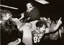  ?? The Chronicle 1981 ?? Niners fans give Ray Wersching a lift at the San Jose Airport a day after he kicked the game-winner as time expired.