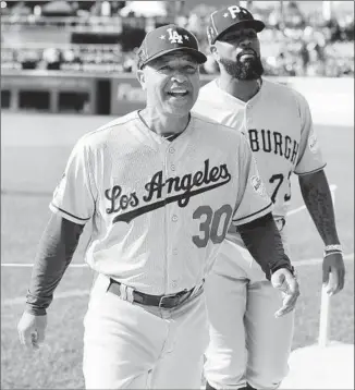  ?? David Maxwell EPA/Shuttersto­ck ?? DAVE ROBERTS has seen the Dodgers make late moves before. “If we line up something that moves the needle — great,” he said. “If we don’t then, we’re prepared to go forward with this club.”