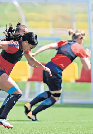  ??  ?? On the run: Jill Scott (centre) with her England team-mates in training