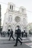  ?? PHOTO: REUTERS ?? On watch . . . Police patrol in front of Notre Dame church, Nice, where the attack took place.