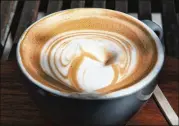  ?? RICHARD VOGEL / ASSOCIATED PRESS ?? A 10-year study released on Monday shows that coffee drinkers had a lower risk of death than abstainers, including those who downed at least eight cups daily.