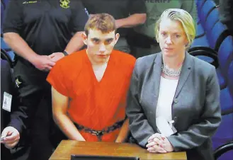  ?? Susan Stocker ?? South Florida Sun-sentinel A video monitor shows school shooting suspect Nikolas Cruz making an appearance Thursday before Judge Kim Theresa Mollica in Broward County Court in Fort Lauderdale, Fla.