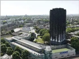  ?? DAVID MIRZOEFF — PA VIA AP ?? Grenfell Tower in west London after a fire engulfed the 24-storey building on Wednesday morning, Saturday. Public fury over the London high-rise fire is mounting as exhausted London firefighte­rs continue their grim search Saturday for victims of the...