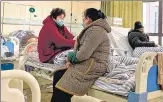  ?? AFP ?? Patients with Covid-19 rest in beds at Fengyang People’s Hospital in Fengyang County in east China’s Anhui province.