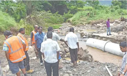  ?? Photo: Charles Chambers ?? Minister for Local Government, Environmen­t, Housing, Infrastruc­ture and Transport Parveen Bala at the damaged Qalele Crossing in Tavua yesterday with Fiji Roads Authority officials.