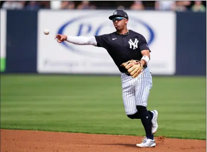  ?? AP PHOTO/CHARLIE NEIBERGALL ?? New York Yankees shortstop Oswald Peraza throws to first base during the first inning of a spring training baseball game against the Tampa Bay Rays Wednesday, March 6, 2024, in Tampa, Fla.