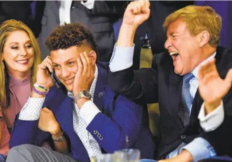  ?? Chelsea Purgahn / Associated Press 2017 ?? Agent Leigh Steinberg (right) got help with his redemption story by landing Patrick Mahomes (center), the 10th overall choice of the 2017 NFL draft. Mahomes is the league’s reigning MVP.