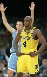  ?? SUSAN RAGAN — THE ASSOCIATED PRESS FILE ?? Michigan’s Chris Webber (4) stands by as North Carolina’s Eric Montross celebrates during North Carolina’s technical foul shots in the final seconds of the NCAA championsh­ip game at the Superdome in New Orleans.