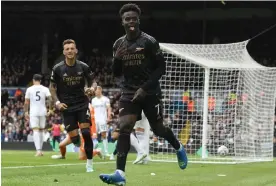 ?? Leeds. Photograph: David Price/Arsenal FC/Getty Images ?? Bukayo Saka celebrates scoring what turned out to be the game’s only goal as Arsenal beat