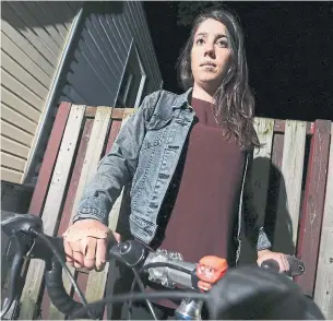  ?? STEVE RUSSELL TORONTO STAR ?? Karen Segal, a 32-year-old lawyer, loves riding her bike to work, but is increasing­ly aware of the risks she takes daily. She was hit by a car on her way to work Thursday morning.