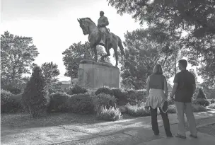  ??  ?? The statue of Robert E. Lee in Emancipati­on Park is shown earlier this month in Charlottes­ville, Va. Looking to distance the family from the white supremacis­ts who rallied here, some of Lee’s descendant­s have issued public calls for statues of the...