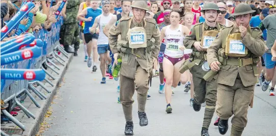  ?? PHOTOS: ASHLEY FRASER ?? Racers taking part in the Vimy Challenge, part of the 10th anniversar­y of the Canada Army Run, wore historic uniforms for the race Sunday.