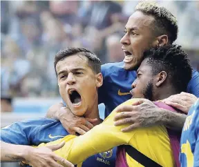  ?? AP ?? Brazil’s Philippe Coutinho (left) celebrates scoring his side’s opening goal with Neymar (top) and another teammate during the Group E match against Costa Rica at the 2018 World Cup in St Petersburg, Russia, Friday, June 22. Black Brazilians face...