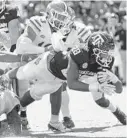  ?? SAM CRAFT/AP ?? Texas A&M running back Isaiah Spiller (28) dives over the goal line for a touchdown.