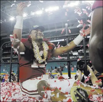  ?? Lynne Sladky The Associated Press ?? Alabama quarterbac­k Tua Tagovailoa throws confetti in the air after the top-ranked Crimson Tide beat No. 4 Oklahoma 45-34 in a College Football Playoff semifinal game Saturday at the Orange Bowl in Miami Gardens, Fla.