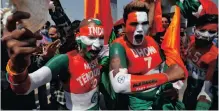  ?? ?? PASSIONATE Indian cricket fans show their “true colours” on the stands. | AMIT DAVE Reuters