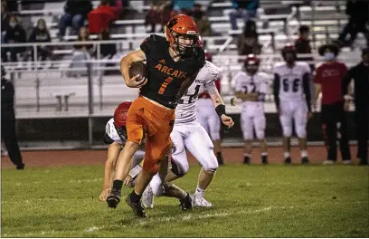  ?? PHOTOS BY JOSE QUEZADA, HUMEDIA — FOR THE TIMES-STANDARD ?? Arcata High quarterbac­k Shane Purcell kept McKinleyvi­lle High’s defense on its toes with his effective passing and rushing.