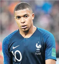  ?? CHRISTOPHE SIMON / AFP / GETTY IMAGES ?? Kylian Mbappé has been causing a stir on the pitch in Russia. “To be 19 years old and creating that panic at a World Cup is huge,” says commentato­r Rio Ferdinand.