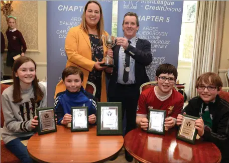  ??  ?? Maeve Duggan , Daniel Culligan, Ciaran Devine St Patricks National School Monasterbo­ice Credit Union Section A Winners with Amy Thornton with the Eamon Thornton Perpetual Cup and Chairperso­n Peter Mc Guirk at the Chapter 5 Credit Union Schools Quiz at...