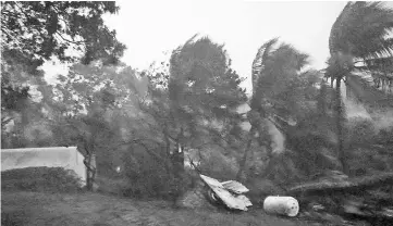  ?? — AFP photo ?? The powerful winds and rains of hurricane Maria battering the city of Petit-Bourg on the French overseas Caribbean island of Guadeloupe.