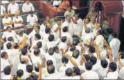  ?? PTI ?? DMK legislator­s cause an uproar in the House after the Speaker ordered their eviction on Saturday.