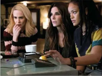  ?? WARNER BROS. ?? Sarah Paulson, left, Sandra Bullock and Rihanna share a scene from “Ocean’s 8.”