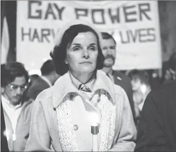  ?? PAUL SAKUMA — THE ASSOCIATED PRESS ?? Then-San Francisco Mayor Dianne Feinstein carries a candle as she leads an estimated 15,000marcher­s also carrying candles during a march in memory of slain Mayor George Moscone and Supervisor Harvey Milk in San Francisco on Nov. 28, 1979. LGBTQ+ leaders are lauding Feinstein as a longtime friend at a time when not many could be found.