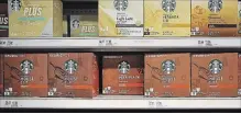  ?? DREW ANGERER GETTY IMAGES ?? Nestlé is spending over US$7 billion for the rights to market and sell Starbucks products.