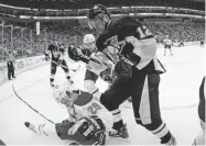  ?? GENE PUSKAR/ THE ASSOCIATED PRESS ?? Penguins’ Jarome Iginla stands over Canadiens defenceman Josh Gorges after a second-period collision on Wednesday.