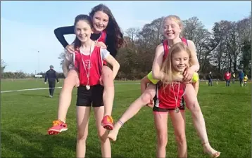  ??  ?? Tara O’Connor, Abaigh Moonan, Enya Silkena and Grainne Moran enjoying themselves after winning the U-12 girls 4 x 500m relay.