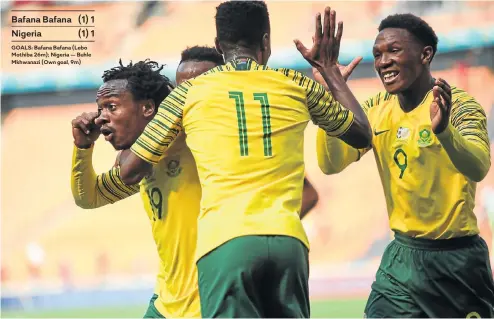  ?? Bafana Bafana (1) 1 Nigeria (1) 1 Picture: Alaister Russell ?? GOALS: Bafana Bafana (Lebo Mothiba 26m); Nigeria — Buhle Mkhwanazi (Own goal, 9m) Percy Tau, left, celebrates the equalizer by Lebo Mothiba (No. 9) during yesterday’s encounter at FNB Stadium.