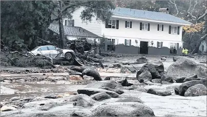  ?? "1 1)050 ?? In this photo provided by Santa Barbara County Fire Department, mud and debris flow due to heavy rain in Montecito. Calif., Tuesday.