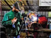  ??  ?? Students at the Georgia Trade School in Acworth learn a variety of welding skills through hands-on instructio­n.