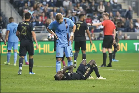  ?? MIKEY REEVES — FOR MEDIANEWS GROUP ?? New York City defender Anton Tinnerholm stands over Union midfielder Jamiro Monteiro in the second half of the Union’s 2-1loss to NYC Sunday.