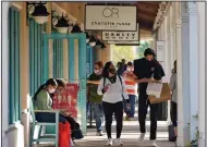  ?? (AP/Chris O’Meara) ?? Shoppers look for Black Friday deals last month at an outlet mall in Ellenton, Fla.