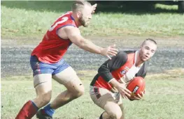  ??  ?? Right: Buln Buln coach Matt Gray atttempts to tackle Nyora’s Dylan Heylen.