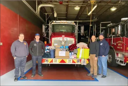  ?? SUBMITTED PHOTO ?? On Tuesday, from left, Kennett Fire Company firefighte­rs Jared Poole, Justin Krieger, T.J. Male and Cory Mackintosh celebrate the receipt of donations from the community to support the people of Ukraine.