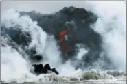  ?? JAE C. HONG — THE ASSOCIATED PRESS ?? In this file photo, lava flows into the ocean near Pahoa, Hawaii.