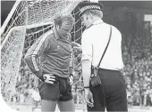  ??  ?? Roy Baines is ticked off by a policeman after celebratin­g a missed penalty 40 years ago