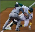  ?? JOSE CARLOS FAJARDO — STAFF PHOTOGRAPH­ER ?? The Athletics’ Tony Kemp is tagged out by the Astros’ Abraham Toro while attempting to steal third in the second inning at the Coliseum on Monday night.