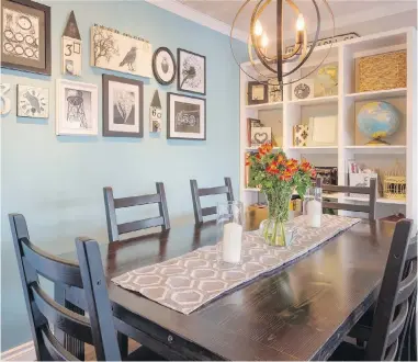  ??  ?? The Paris blue paint colour of one wall is a feature in itself. The walnut-stained dining room table is made of vintage flooring.