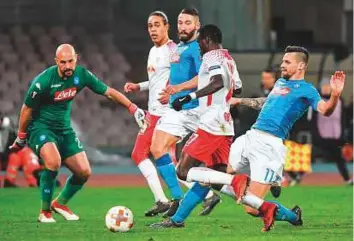  ?? AFP ?? Leipzig’s Portuguese midfielder Bruma (second from right) scores against Napoli during the Europa League match at San Paolo stadium in Naples.