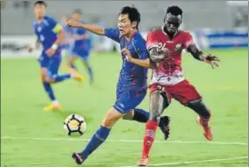  ?? PTI ?? Kenya player Vincent Wasambo (in red) and Chinese Taipei player Chienming Wang (in blue) vie for the ball during the Hero Interconti­nental football Cup in Mumbai on Friday.