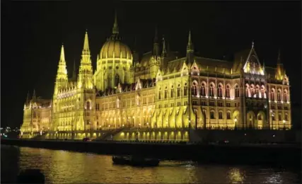  ?? PHOTO BY SANDRA NOWLAN ?? The Budapest Parliament Building lights up the Danube at night in a brilliant show.