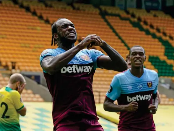  ??  ?? Michail Antonio celebrates scoring one of his four goals at Carrow Road (AP)